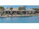 Relaxing poolside pavilion with covered seating and grilling station at 12734 Rainwashed Loop, Parrish, FL 34219
