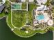 Aerial view of community amenities including pool, playground, and basketball court at 12734 Rainwashed Loop, Parrish, FL 34219