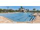 Resort-style pool with waterslide, ample deck space, and a poolside grilling area at 12734 Rainwashed Loop, Parrish, FL 34219