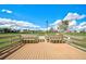 Wooden deck with benches overlooking a park-like setting at 12734 Rainwashed Loop, Parrish, FL 34219