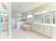 Large bathroom boasting double sinks, a soaking tub, and a separate shower at 12734 Rainwashed Loop, Parrish, FL 34219