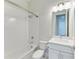 Clean bathroom with white subway tiles, a bathtub, and a vanity at 12734 Rainwashed Loop, Parrish, FL 34219