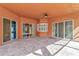 Covered patio with brick pavers and sliding glass doors at 111 172Nd E St, Bradenton, FL 34212