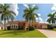 Beautiful stucco home with palm trees and driveway at 111 172Nd E St, Bradenton, FL 34212