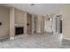 Living room with fireplace, tiled floors, and double doors at 3311 46Th E St, Palmetto, FL 34221