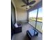 Comfortable balcony features wicker furniture, a view, and plenty of sunlight at 7005 River Hammock Dr # 404, Bradenton, FL 34212