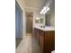 Bathroom area featuring dual sinks, walk in shower and good lighting at 7005 River Hammock Dr # 404, Bradenton, FL 34212