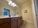 Bathroom features a long vanity, cabinet storage, and a toilet at 7005 River Hammock Dr # 404, Bradenton, FL 34212