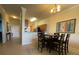 Inviting dining area with table, chairs, and lighting fixture at 7005 River Hammock Dr # 404, Bradenton, FL 34212