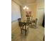 Eat-in kitchen with glass table and four chairs at 7005 River Hammock Dr # 404, Bradenton, FL 34212