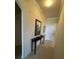 Hallway featuring tile flooring and decorative console table at 7005 River Hammock Dr # 404, Bradenton, FL 34212