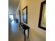 Hallway featuring tile flooring and decorative console table at 7005 River Hammock Dr # 404, Bradenton, FL 34212
