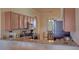 Well-equipped kitchen featuring granite countertops, wooden cabinetry, and stainless steel appliances at 7005 River Hammock Dr # 404, Bradenton, FL 34212