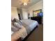 The bedroom offers a spacious layout with a large dresser and access to a closet at 7005 River Hammock Dr # 404, Bradenton, FL 34212