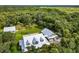 Aerial view showcasing a house, guest house, and expansive property at 7091 Saddle Creek Ln, Sarasota, FL 34241