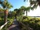 Scenic boardwalk path through lush tropical landscaping at 1700 Glenhouse Dr # 406, Sarasota, FL 34231