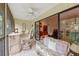 Spacious screened porch with access to living room at 1700 Glenhouse Dr # 406, Sarasota, FL 34231