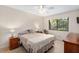 Cozy bedroom with a ceiling fan and neutral color scheme at 1700 Glenhouse Dr # 406, Sarasota, FL 34231