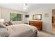 Comfortable bedroom with a large window and ample storage at 1700 Glenhouse Dr # 406, Sarasota, FL 34231