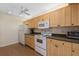 Bright kitchen with ample cabinetry and modern appliances at 1700 Glenhouse Dr # 406, Sarasota, FL 34231