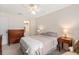 Bright bedroom with a ceiling fan and ensuite bathroom at 1700 Glenhouse Dr # 406, Sarasota, FL 34231