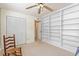 Room with built-in bookshelves and a ceiling fan at 1700 Glenhouse Dr # 406, Sarasota, FL 34231