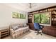 Home office features built-in bookshelves and window seat at 1700 Glenhouse Dr # 406, Sarasota, FL 34231