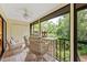 Enjoy the view from this screened porch with wicker furniture at 1700 Glenhouse Dr # 406, Sarasota, FL 34231