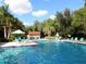 Community pool with plenty of lounge chairs for relaxation at 1700 Glenhouse Dr # 406, Sarasota, FL 34231