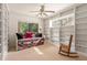Room with built-in bookshelves and a daybed at 1700 Glenhouse Dr # 406, Sarasota, FL 34231