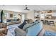 Spacious living room with ceiling fan and access to back yard at 4457 Maywood Ln, North Port, FL 34286