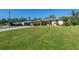 Single-Gathering home situated on a large lot with ample green space at 4457 Maywood Ln, North Port, FL 34286