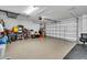 Garage interior with overhead door and extra storage at 4457 Maywood Ln, North Port, FL 34286