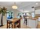 Kitchen with breakfast nook and view into living room at 4457 Maywood Ln, North Port, FL 34286