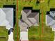 Overhead view of a house showing its roofline, yard, and driveway at 4457 Maywood Ln, North Port, FL 34286