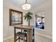 Cozy breakfast nook with a small table and two stools, adjacent to a window at 4457 Maywood Ln, North Port, FL 34286