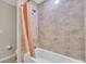 Bathroom featuring a bathtub, shower, and peach-colored shower curtain at 4457 Maywood Ln, North Port, FL 34286