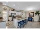 Bright kitchen featuring granite countertops and an island at 4457 Maywood Ln, North Port, FL 34286