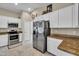 Modern kitchen featuring stainless steel appliances and granite countertops at 4457 Maywood Ln, North Port, FL 34286