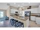 Open kitchen with granite island and stainless steel appliances at 4457 Maywood Ln, North Port, FL 34286