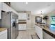 Spacious kitchen with stainless steel appliances and granite countertops at 4457 Maywood Ln, North Port, FL 34286