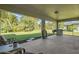 Spacious covered patio with backyard access and grill at 4457 Maywood Ln, North Port, FL 34286