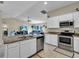 Spacious kitchen with stainless steel appliances and an island at 4457 Maywood Ln, North Port, FL 34286