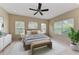 Spacious bedroom with neutral decor, a ceiling fan, and ample natural light at 4807 Harvest Grove Pl, Parrish, FL 34219