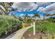 Landscaped walking path with park bench at 4807 Harvest Grove Pl, Parrish, FL 34219