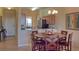 Round dining table with six chairs, kitchen view at 7005 River Hammock Dr # 404, Bradenton, FL 34212