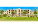 Condo building with covered parking and landscaping at 7005 River Hammock Dr # 404, Bradenton, FL 34212