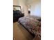 Spacious bedroom with a king-size bed and dresser at 7005 River Hammock Dr # 404, Bradenton, FL 34212