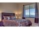 Comfortable bedroom with a queen-size bed and window at 7005 River Hammock Dr # 404, Bradenton, FL 34212