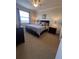 Comfortable bedroom with king bed and nightstands at 7005 River Hammock Dr # 404, Bradenton, FL 34212